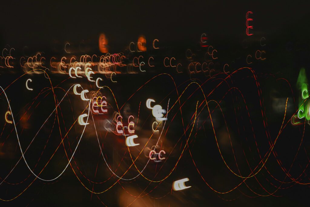 Abstract long-exposure of city light trails representing urban noise and chaos, contrasted with NEOM and The Line’s vision of a silent city